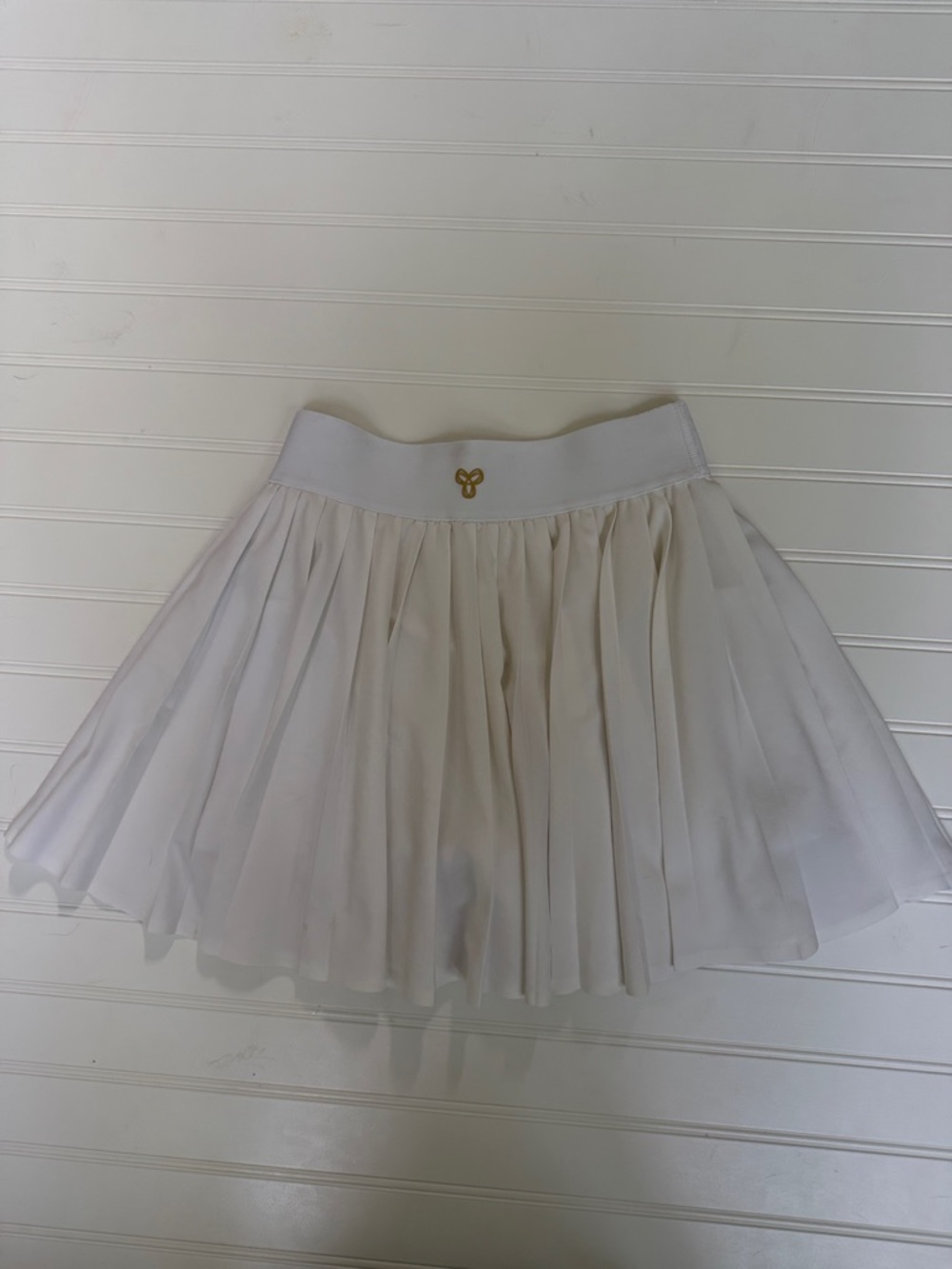 (170)Aritzia White Pleated Circle Skirt with Gold Emblem